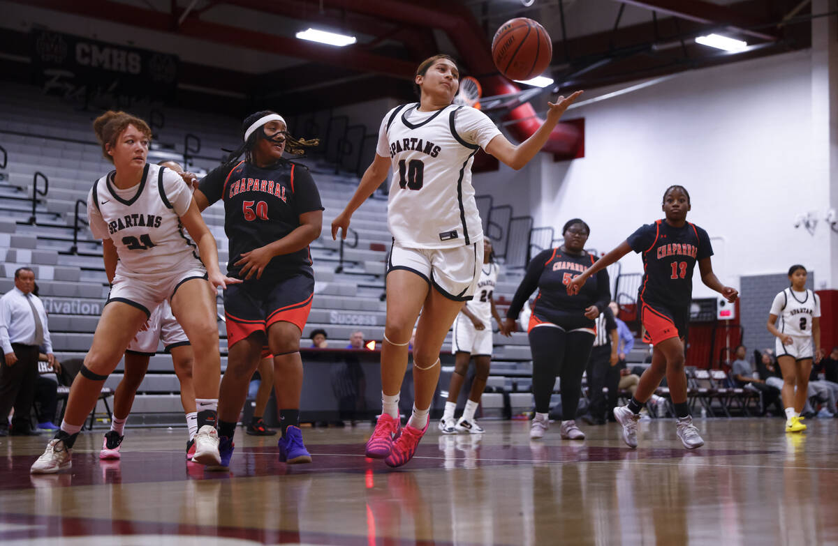 Cimarron-Memorial's Jasmine Ponce (10) reaches for a rebound against Chaparral during a ba ...