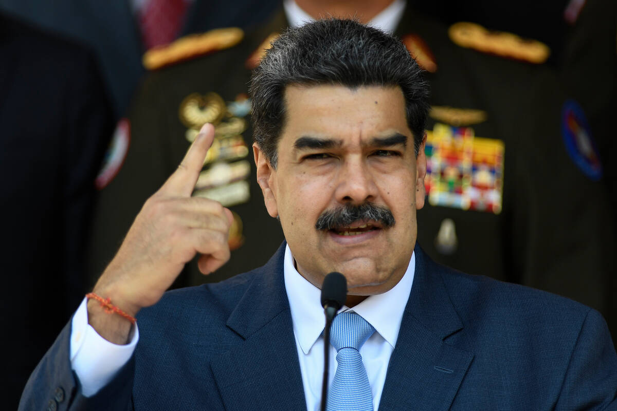 FILE - In this March 12, 2020, file photo, Venezuelan President Nicolas Maduro gives a press co ...