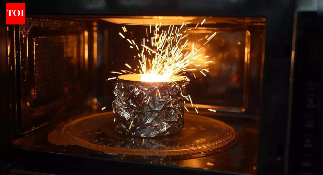 Why does aluminium foil spark in a microwave but not in an oven |