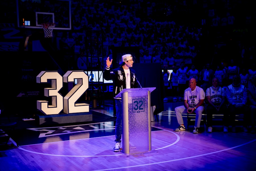 BYU’s Jimmer Fredette speaks as his No. 32 jersey is retired and hung in the rafters during a halftime ceremony during a game against the Colorado Buffaloes at the Marriott Center in Provo on Saturday, Feb. 14, 2026.