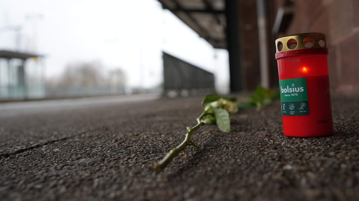 Flowers and candles lie on the platform in Landstuhl, Rhineland-Palatinate, after the death of a train conductor who was violently attacked on Monday. According to the public prosecutor's office in Saarbrücken, the suspect has said he lives in Luxembourg.