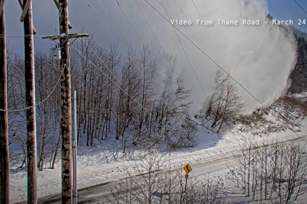 Screenshot of a video from March 24, 2026 at 11:40 a.m. shows the powder cloud reached tidewater, but debris did not reach the roadway. (Alaska Department of Transportation/Facebook)