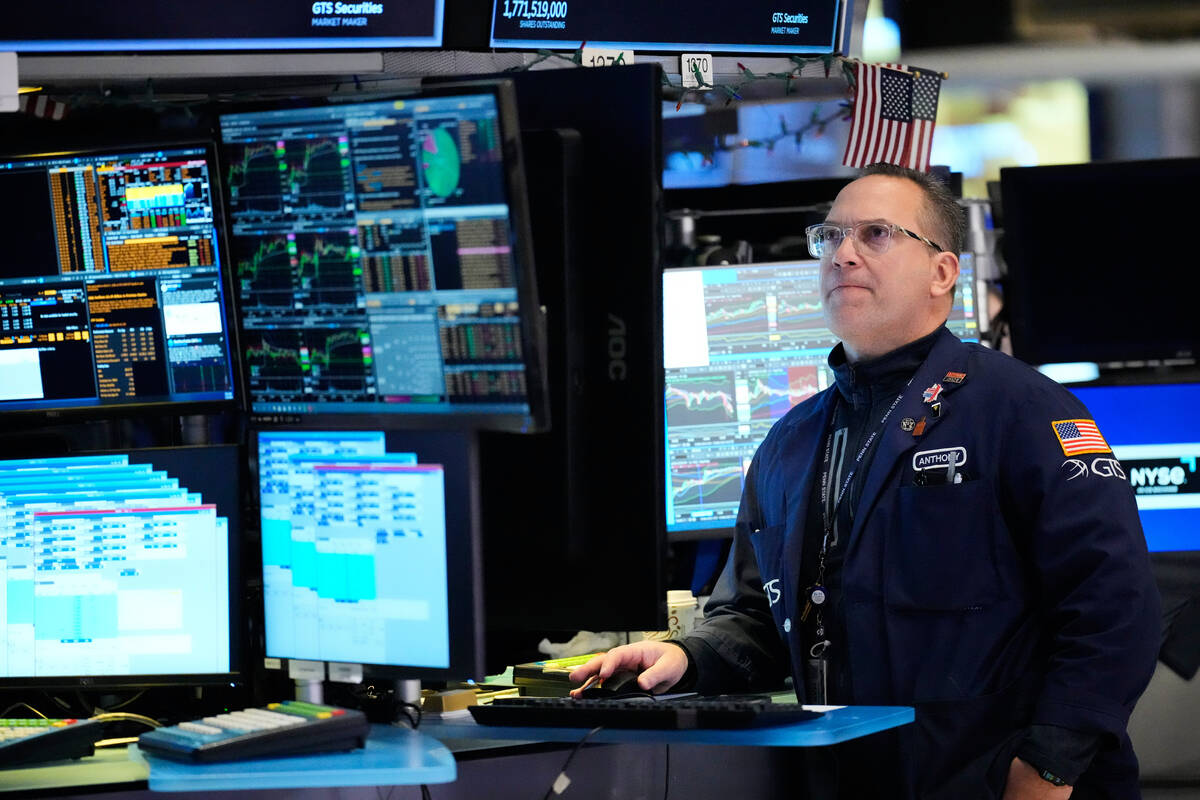 Anthony Matesic works on the floor at the New York Stock Exchange in New York, Thursday, March ...