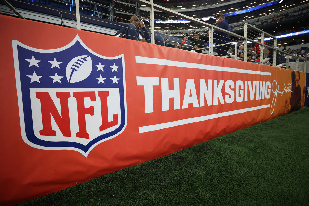 FILE - A Thanksgiving sign is seen around the field before an NFL football game between the Kan ...