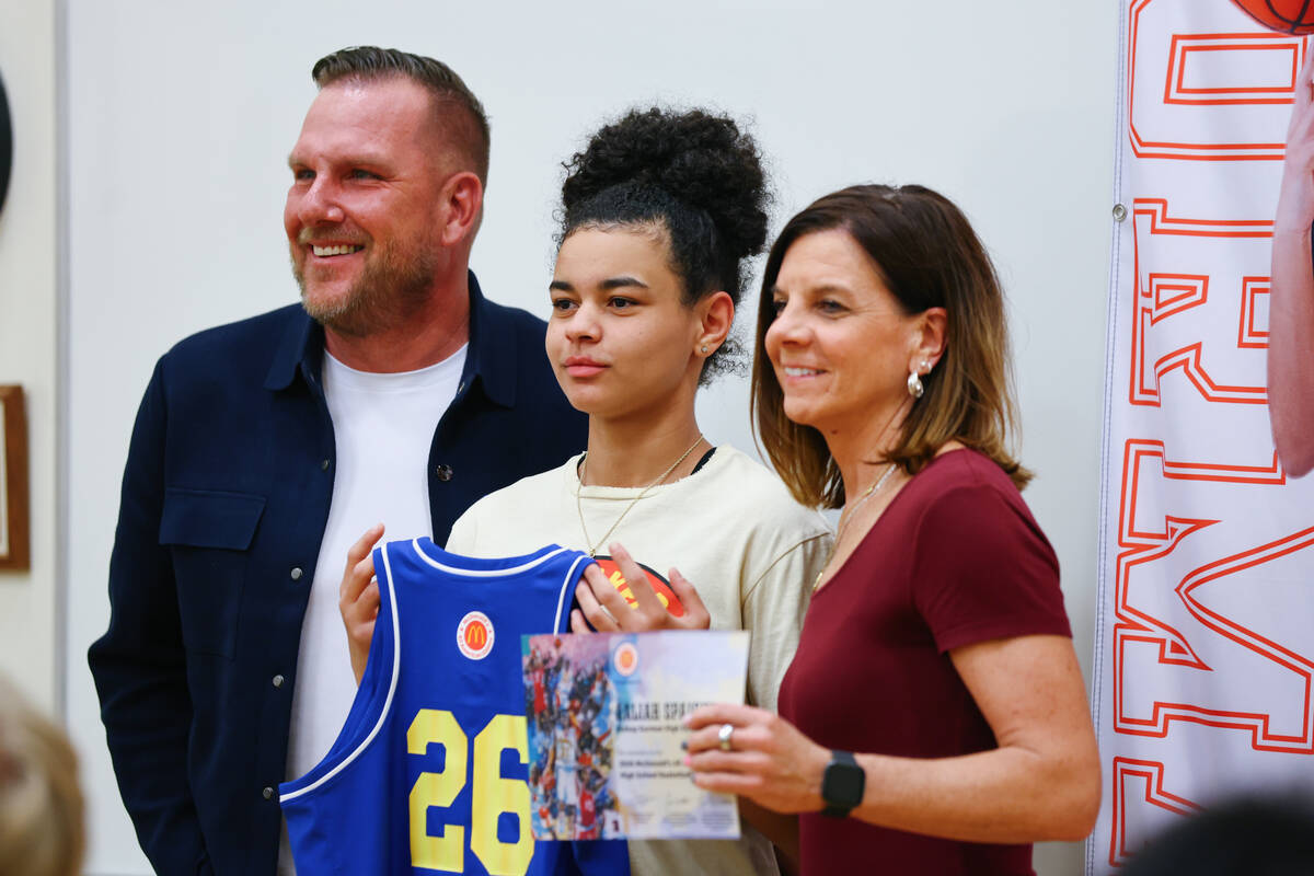 Brent Bohn and Sheryl Krmpotich pose for a photo with Aaliah Spaight after presenting her with ...