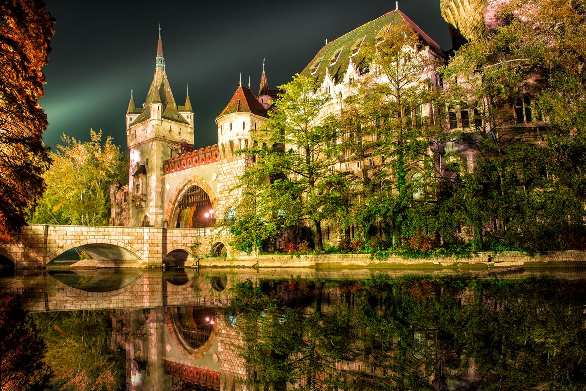 Vajdahunyad castle at the night with lake in Budapest, Hungary City Park