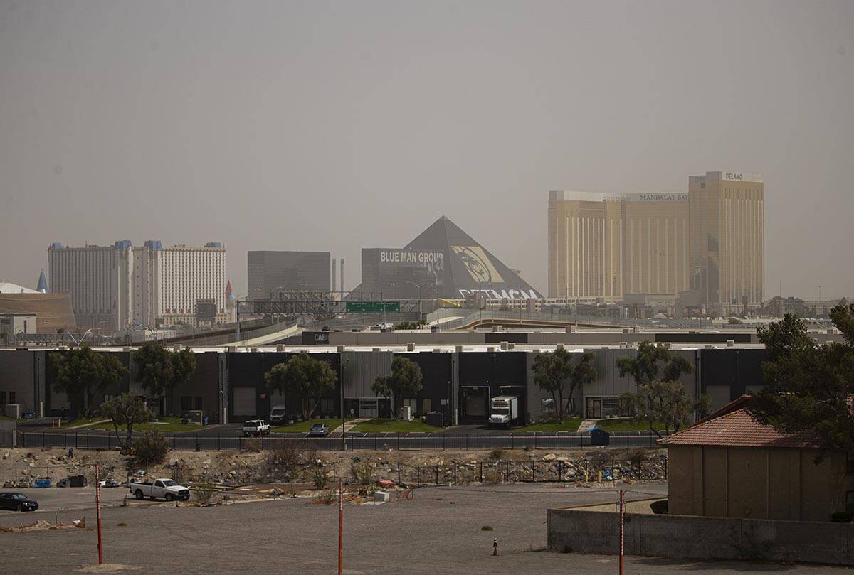 The sky is partially obscured as winds bring in a dust storm on Sunday, May 8, 2022, in Las Veg ...