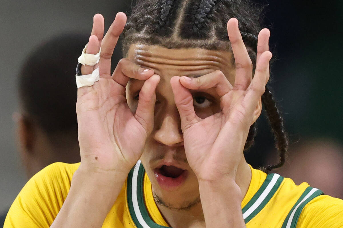 Baylor guard Cameron Carr reacts to his three-point shot against Utah in the first half of an N ...