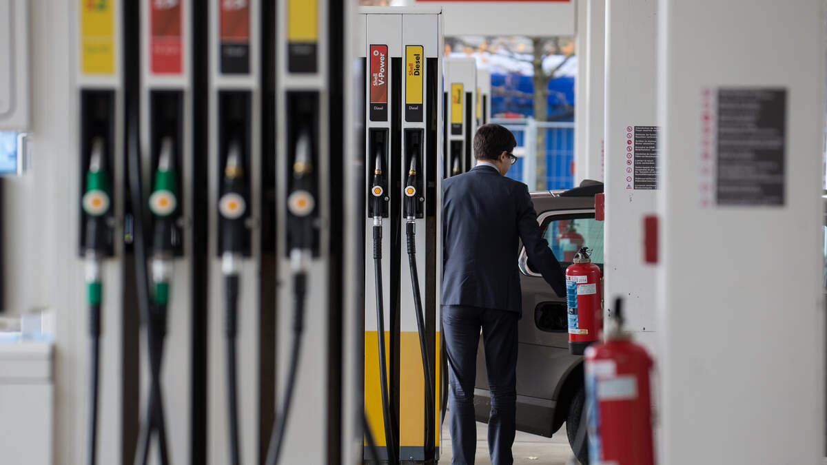A motorist filling up at Berchem service station