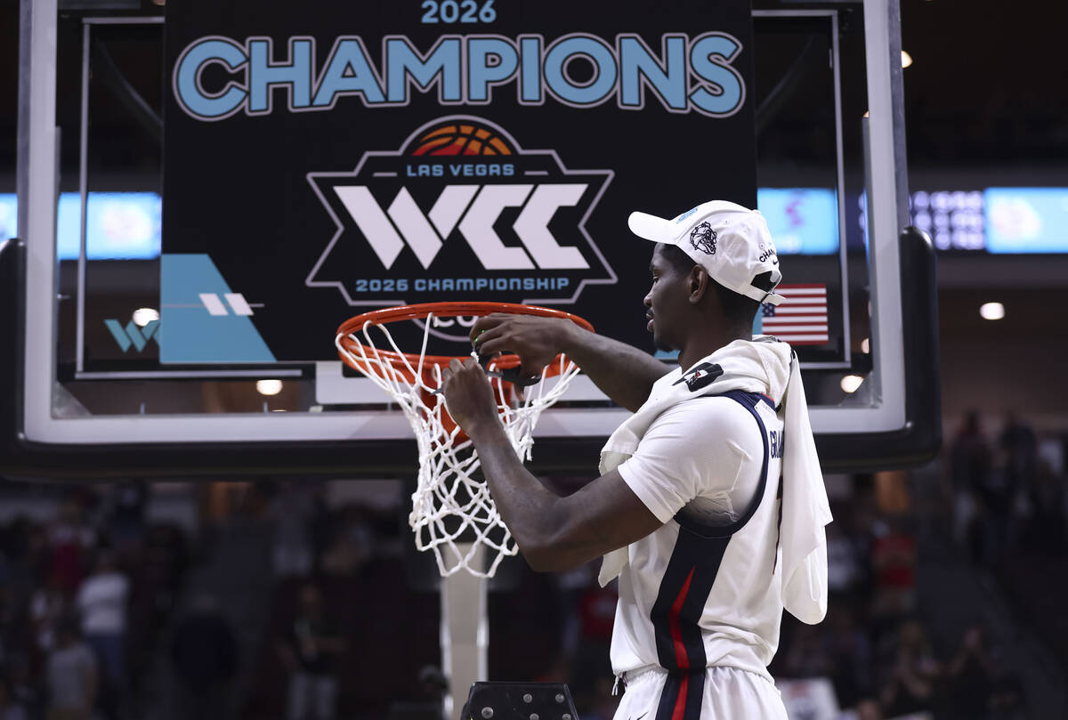 Gonzaga Bulldogs guard Tyon Grant-Foster (7) cuts a piece of the net after defeating the Santa ...