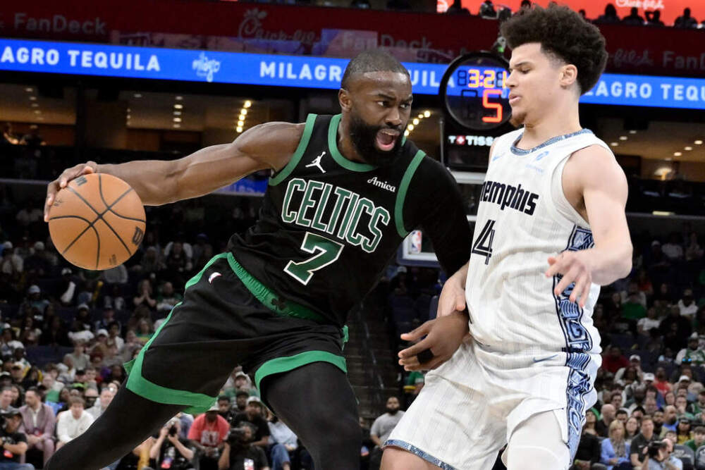 Boston Celtics guard Jaylen Brown (7) drives against Memphis Grizzlies guard Walter Clayton Jr. (4) in the second half of an NBA basketball game Friday, March 20, 2026, in Memphis, Tenn. (AP Photo/Brandon Dill)