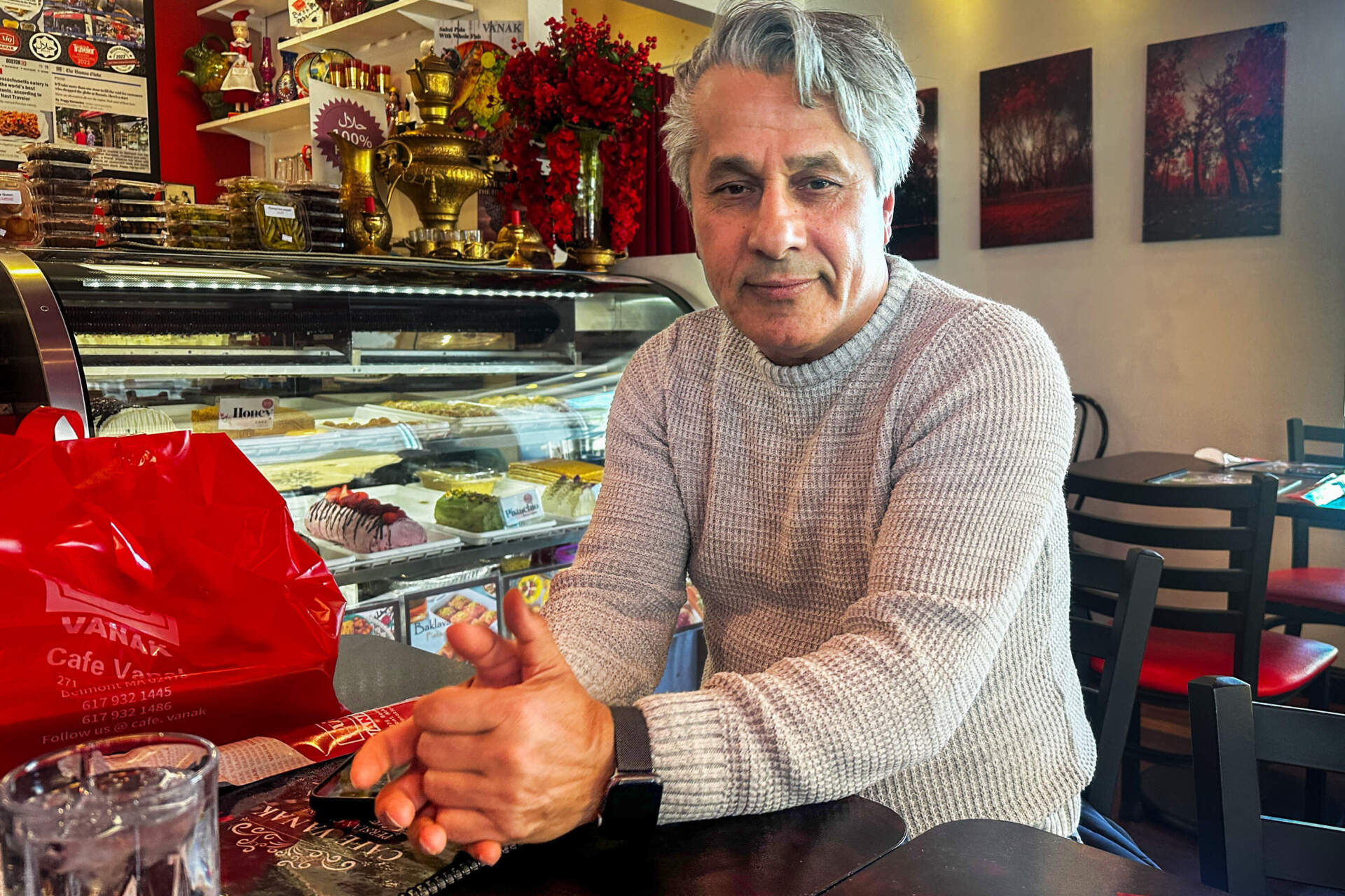 Reza Hassanzadeh at Cafe Vanak in Belmont. (Simón Rios/WBUR)
