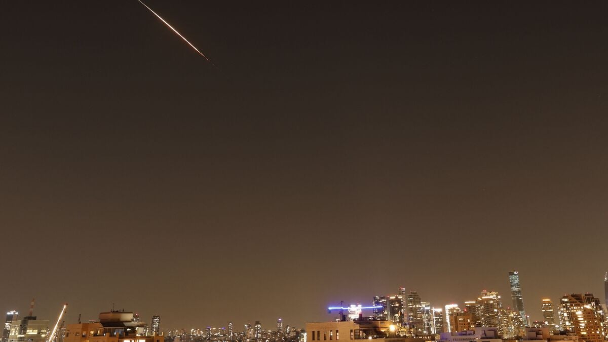 Rocket trails are seen in the sky above the Israeli coastal city of Tel Aviv amid a fresh barrage of Iranian missile attacks on March 11, 2026.
