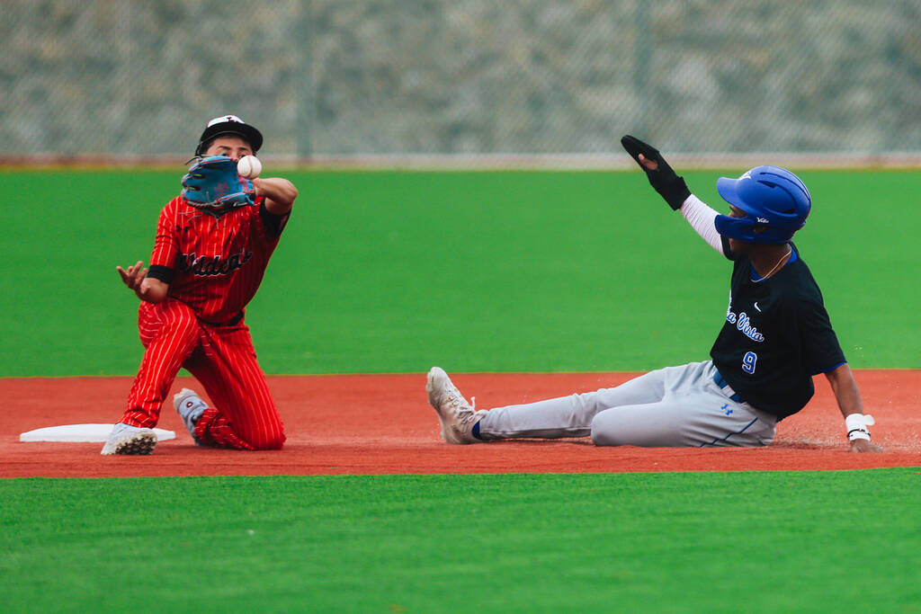 Sierra Vista outfielder Issac Simmon (9) slides to second base in a high school baseball game a ...