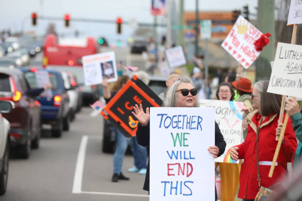 Protesters gather on Broadway during a No Kings Day rally on Saturday, March 28, 2026, in Everett. Washington. (Michael Henneke / The Herald)