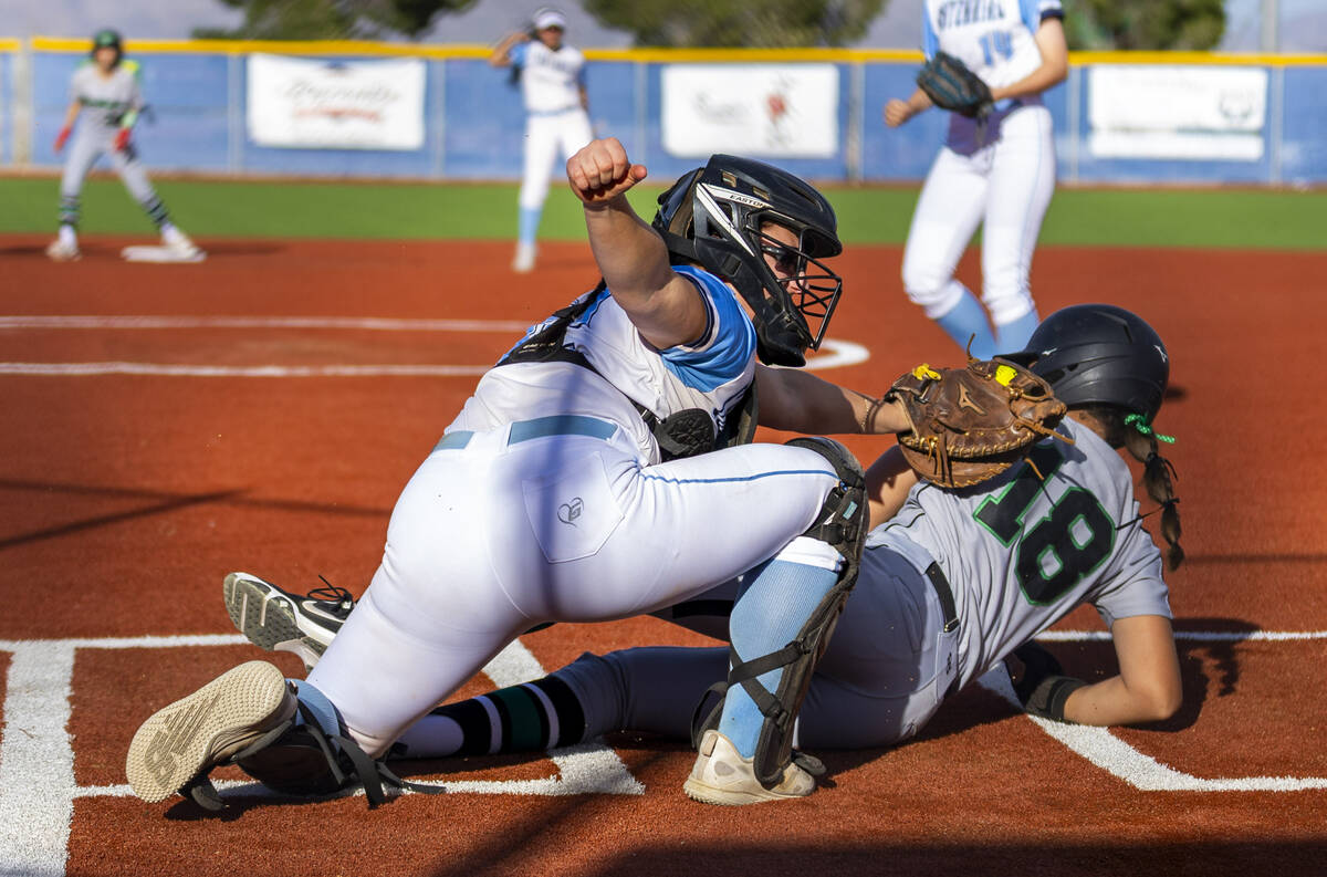Palo Verde runner Keileanna Johnson (18) slides safely at home as Centennial catcher Campbell C ...