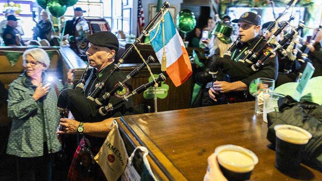 Snohomish County Firefighters Pipes and Drums march into Shawn O’Donnell’s during the pub’s St. Patrick’s Day celebration on Tuesday, March 17, 2026 in Everett, Washington. (Olivia Vanni / The Herald)