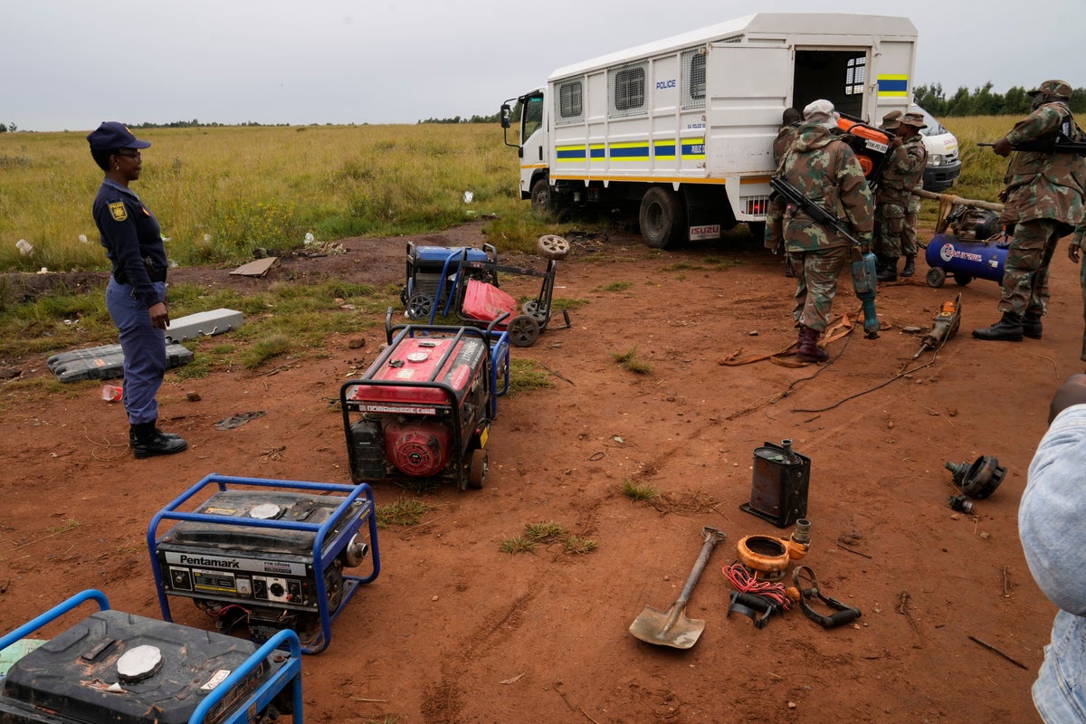 South African soldiers dismantle illegal mining operations near Johannesburg as miners flee