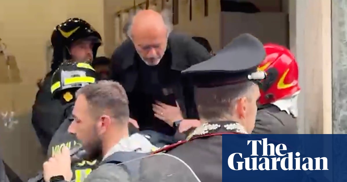 Armed robbers hold 25 people hostage at Naples bank before fleeing through hole in floor | Italy