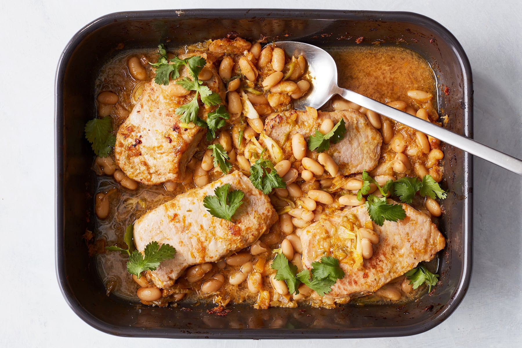 Baked honey-citrus pork chops and beans