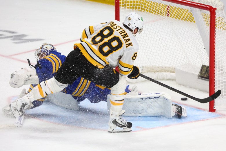 Bruins win in OT, stave off elimination