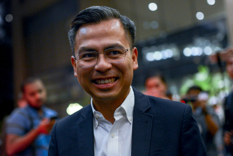 Defamation suits involving Fahmi and political figures settled amicably in separate court proceedings