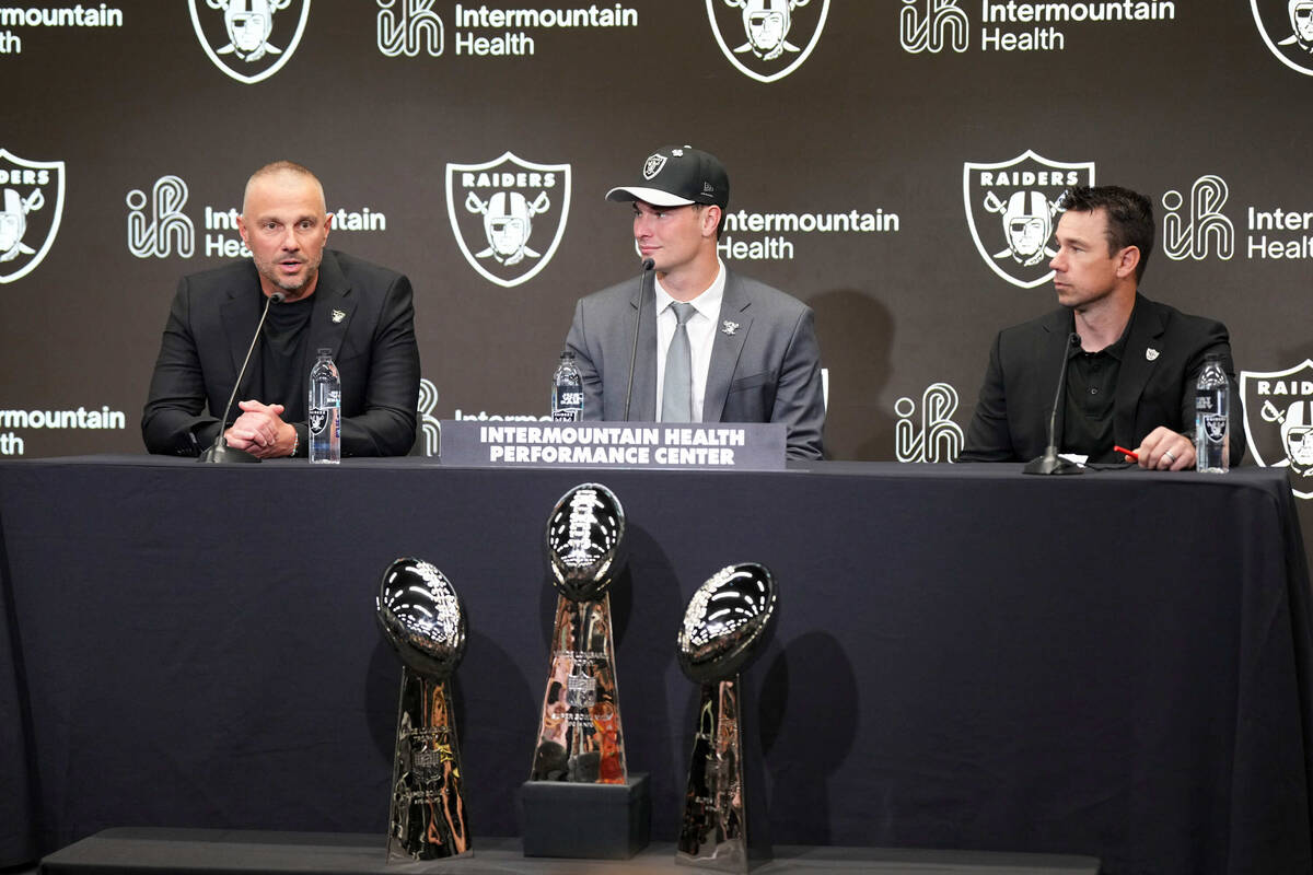 From left to right. Las Vegas Raiders general manager John Spytek, first-round draft pick Ferna ...