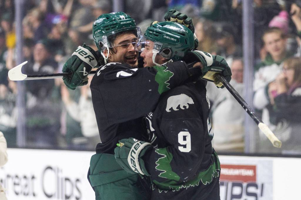 Carter Bear #11 of the Everett Silvertips hugs Landon DuPont #9 after beating the Kelowna Rockets in Game 5 of the Western Hockey League second round to advance to the Western Conference Finals on Friday, April 17, 2026 in Everett, Washington. (Olivia Vanni / The Herald)