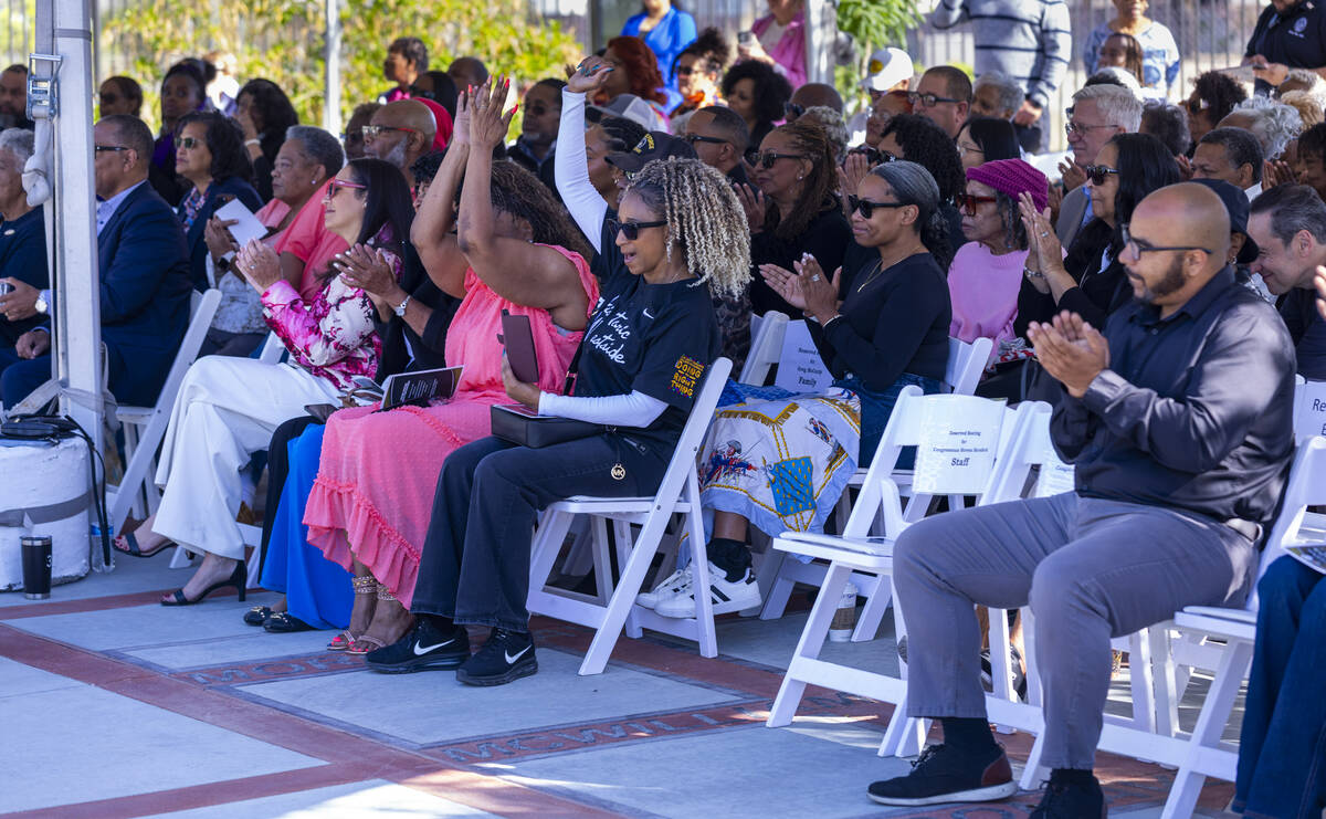 Attendees react to some spoken word poetry by poet Trinity Smith during an induction ceremony f ...