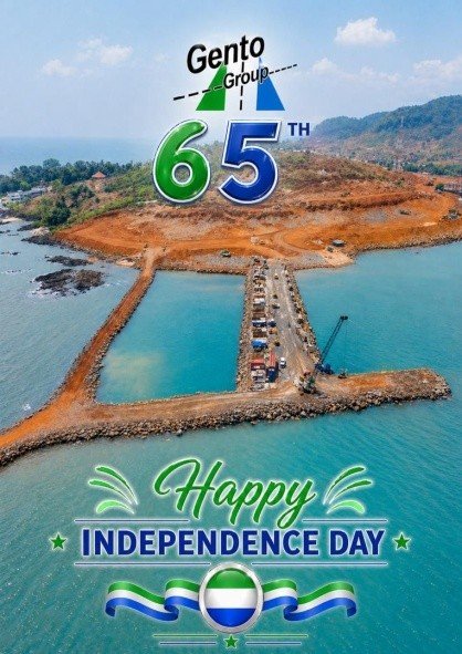 Aerial view of a coastal construction site with blue-green water and the overlaid text 'Gento Group 65th' and 'Happy Independence Day.'