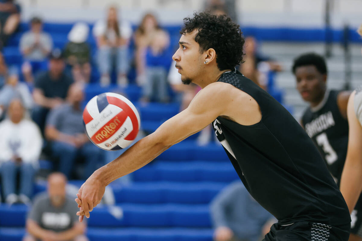 Shadow Ridge outside hitter Zavier Coleman (1) digs a serve from the back row during the boys&# ...