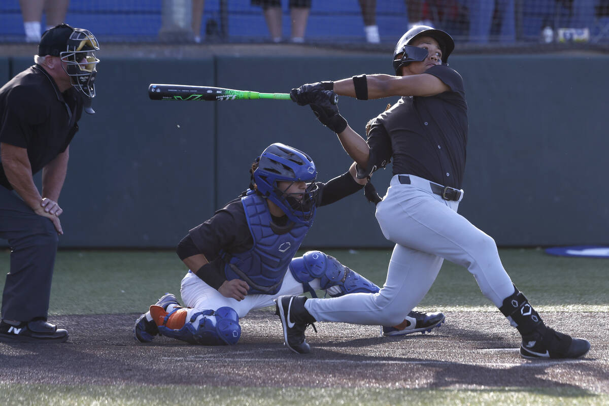Faith Lutheran's Rookie Shepard (5) swings against Bishop Gorman during a baseball game at ...
