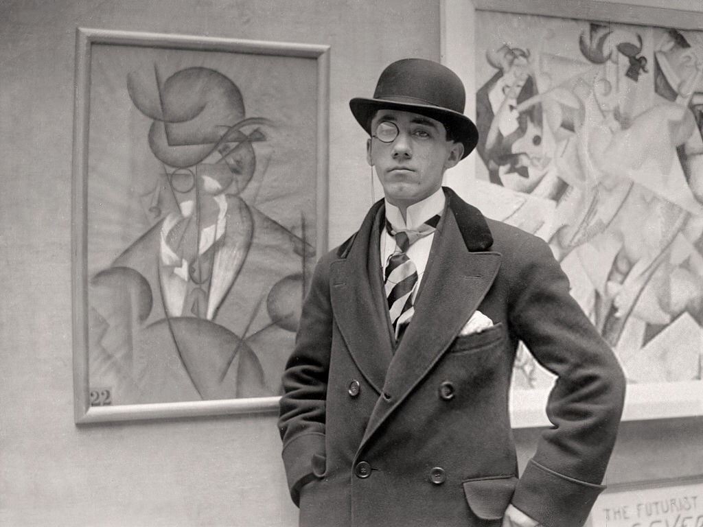 Gino Severini, in 1913 at the opening night of his exhibition at the Marlborough Gallery, London. By Gino Severini - https://painters-in-color.tumblr.com/post/165802108002/italian-artists-gino-severini-at-the-opening-of, PD-US, https://en.wikipedia.org/w/index.php?curid=71736614