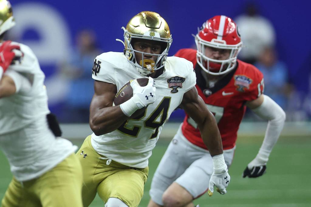 Notre Dames Jadarian Price (24) runs with the ball during the third quarter against Georgia during the Sugar Bowl at Caesars Superdome on Jan. 2, 2025, in New Orleans. (Chris Graythen / Getty Images / Tribune News Services)