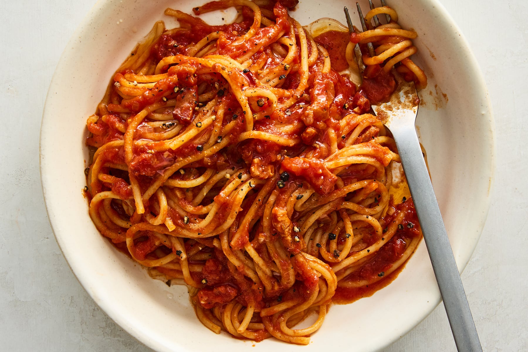 Tomato-braised bacon pasta