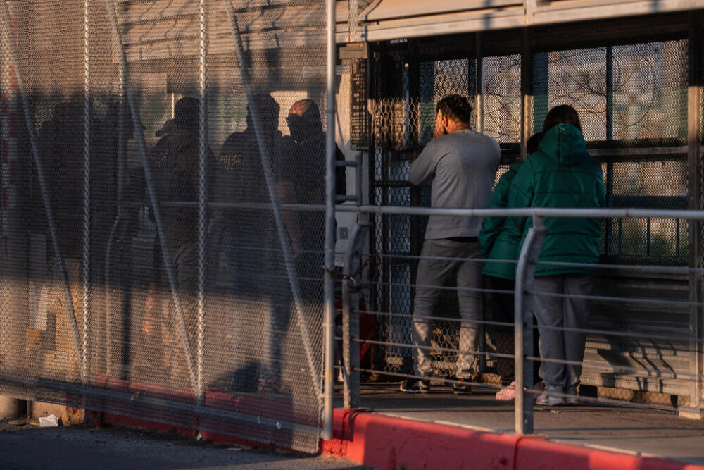 A group of undocumented migrants is deported by U.S. Immigration and Customs Enforcement agents across the McAllen–Hidalgo–Reynosa International Bridge in McAllen, Texas, Friday, March 13, 2026. Dozens of migrants from countries including Cuba, Venezuela, Haiti, China, Guatemala and El Salvador were handed over to Mexican authorities. (AP Photo/Felix Marquez)