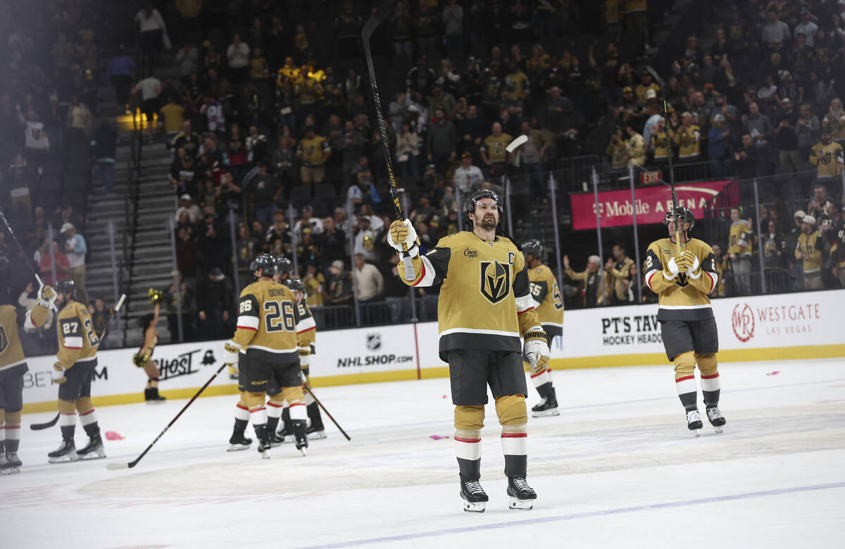 Golden Knights right wing Mark Stone, center right, and the team celebrate their victory over t ...