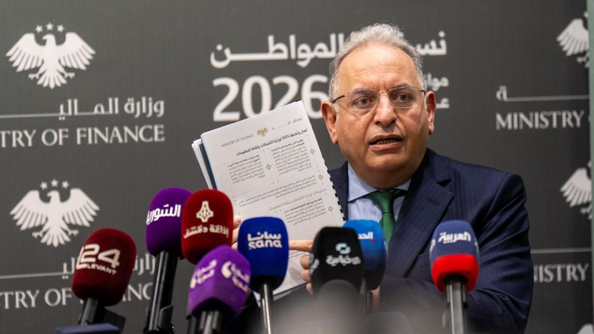 Syrian Finance Minister Mohammed Yisr Barnieh presents the areas through which the surplus in the 2025 budget was achieved during a press conference, April 9, 2026. (Syrian Ministry of Finance, Telegram)