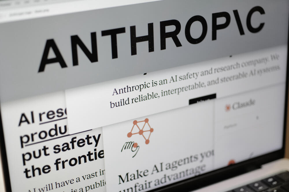 Pages from the Anthropic website and the company's logo are displayed on a computer screen in New York on Feb. 26, 2026. (AP Photo/Patrick Sison, File)