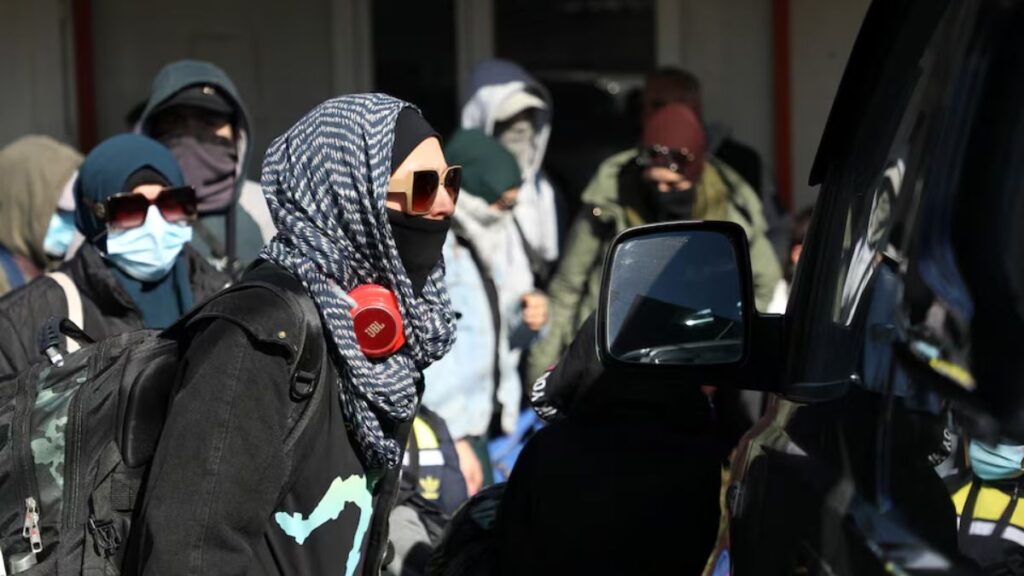 Australian families leaving Roj camp near al-Hasakah, eastern Syria, 16 February 2026 (Reuters)