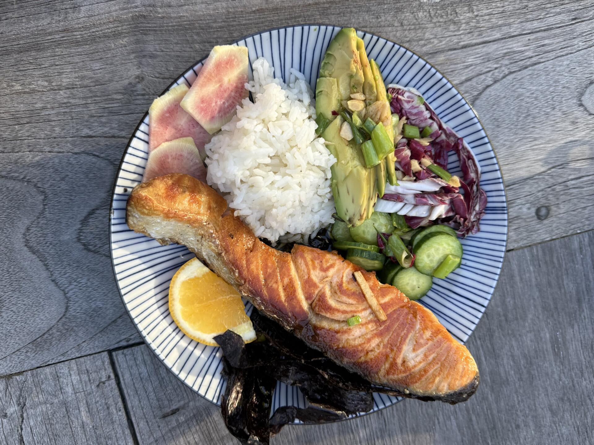 Salmon, rice, avocado, cucumber and radicchio salad with a ginger-lemon dressing. (Kathy Gunst/Here & Now)