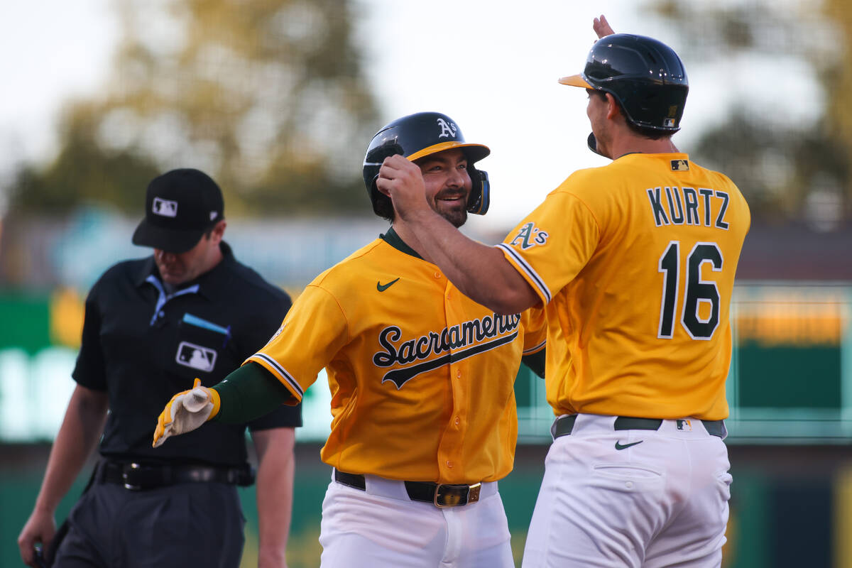 Athletics' Shea Langeliers, second from right, celebrates with teammate Nick Kurtz (16) af ...