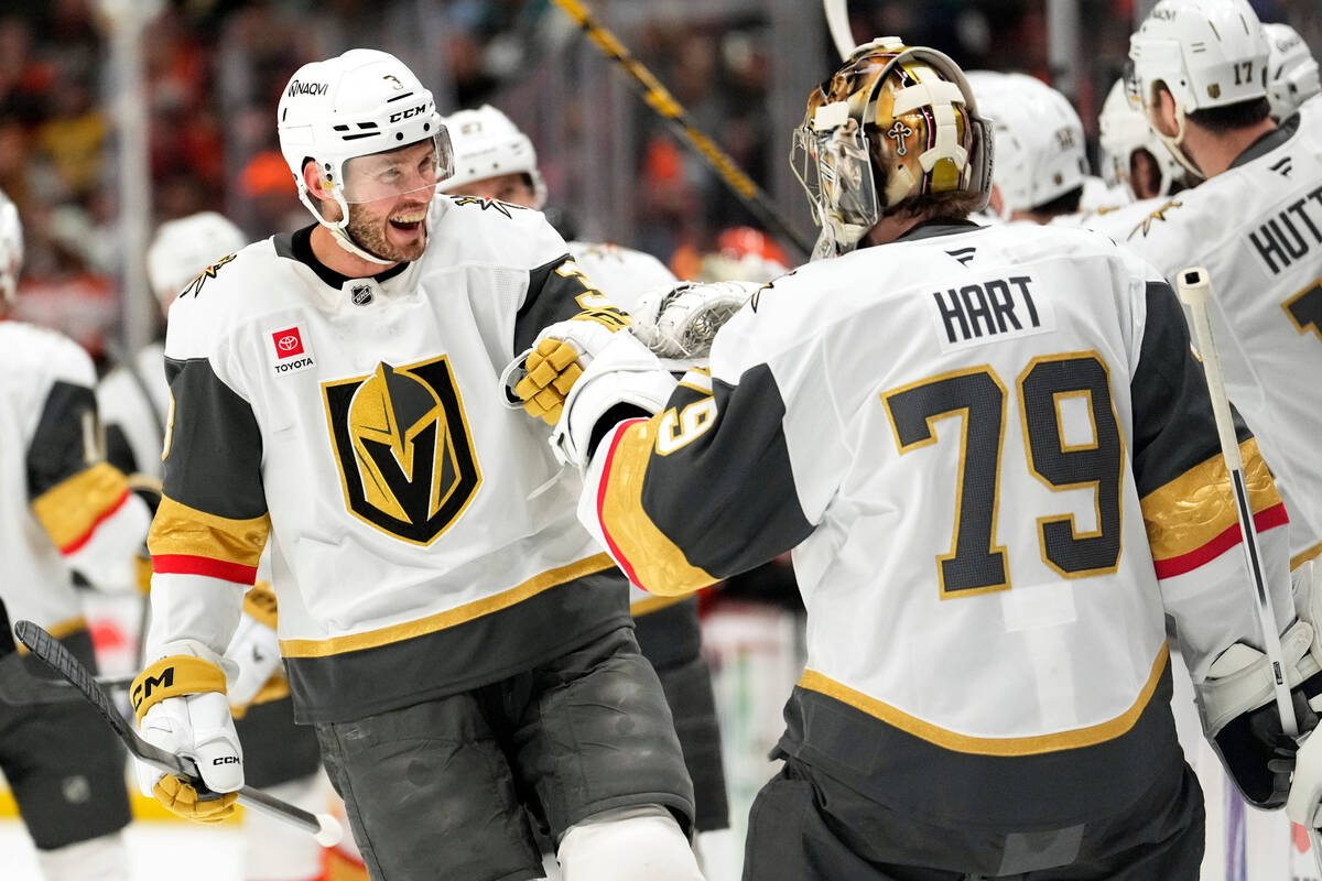Vegas Golden Knights defenseman Brayden McNabb, left, celebrates his goal with goaltender Carte ...