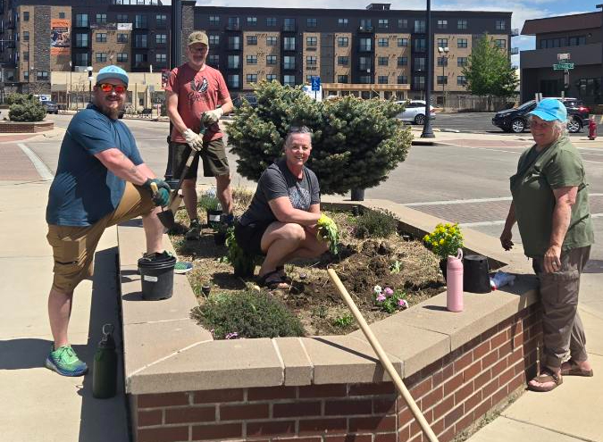 City staff, community members beautify Old Yellowstone District with flower plantings