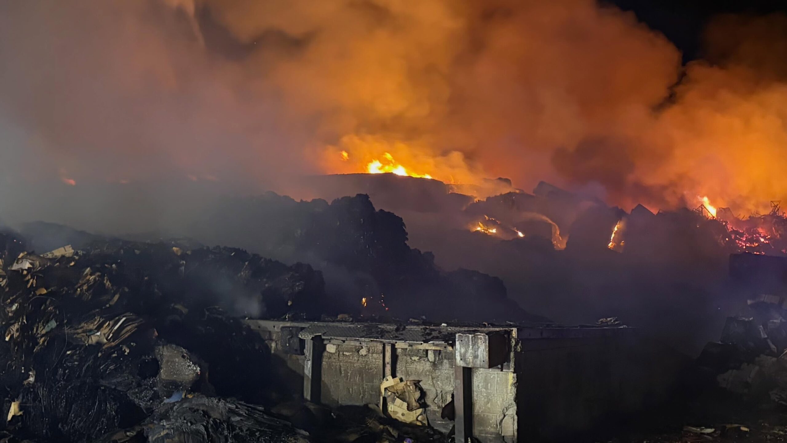 Crews bring recycling yard fire under control in South Valley