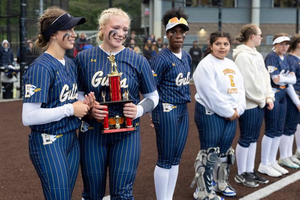 Everetts Ziarah Parker and Haylie Oyler accept the second place 3A District 1 trophy after losing to Sedro-Woolley in the district championship on Thursday, May 14, 2026 in Everett, Washington. (Olivia Vanni / The Herald)