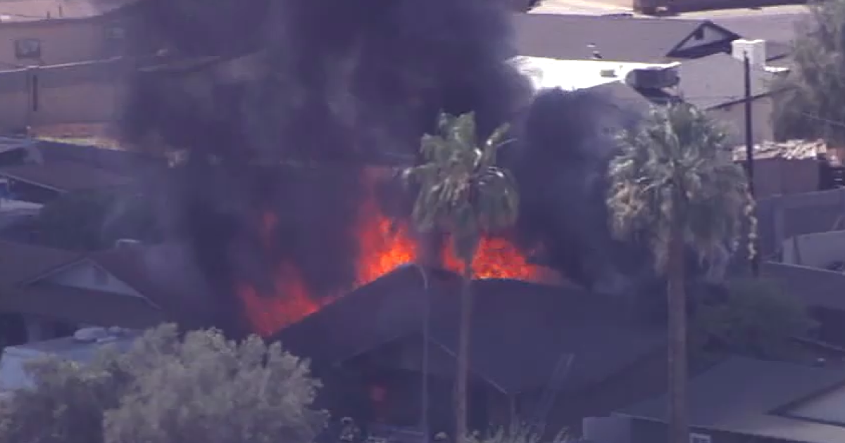 Fire crews contain large house fire near 59th Avenue and Thomas Road
