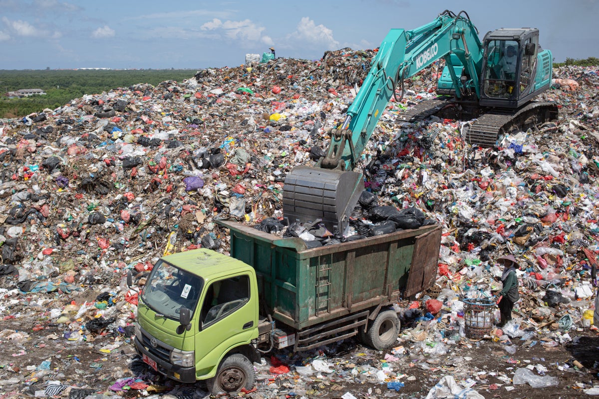 Garbage piles up in Bali after restrictions on resort island’s largest landfill disrupt collection