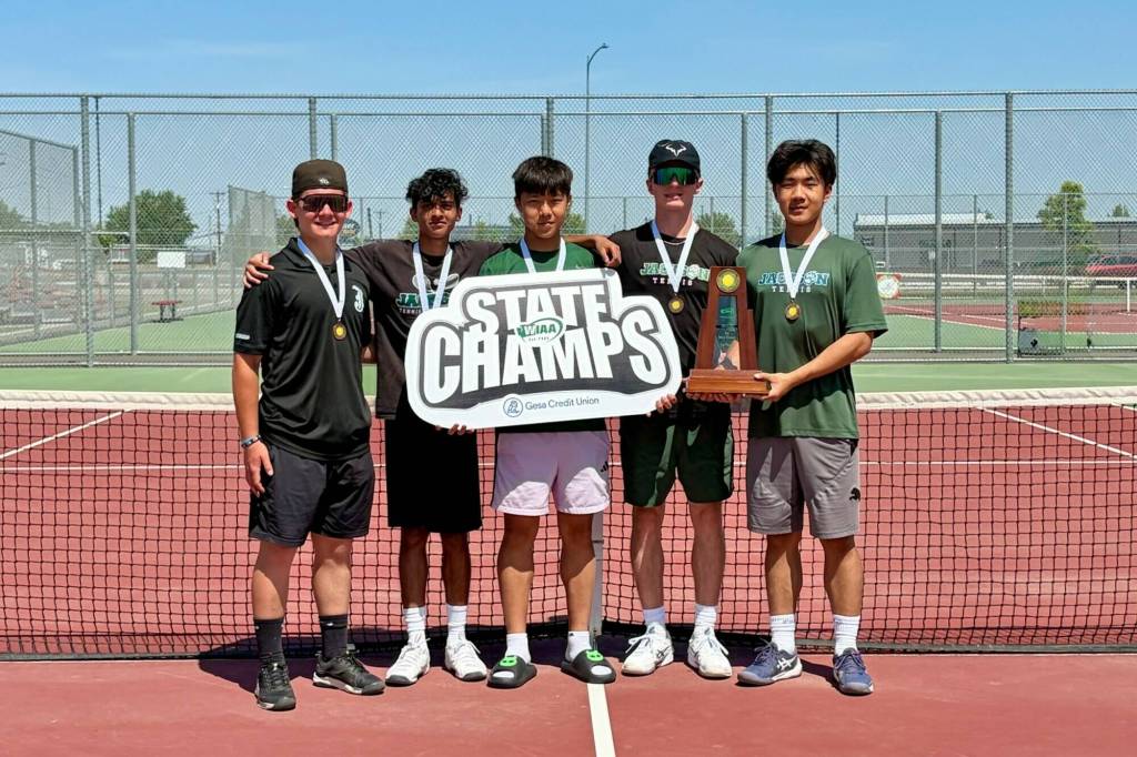 The Jackson boys tennis team (pictured left to right: Ashton Bergman, Arhan Sinha, Sam Song, Andy Stark, David Song) poses with their 4A state title trophy and medals on Saturday, May 23, 2026 in Kennewick, Washington. (Courtesy of Katie Stark)