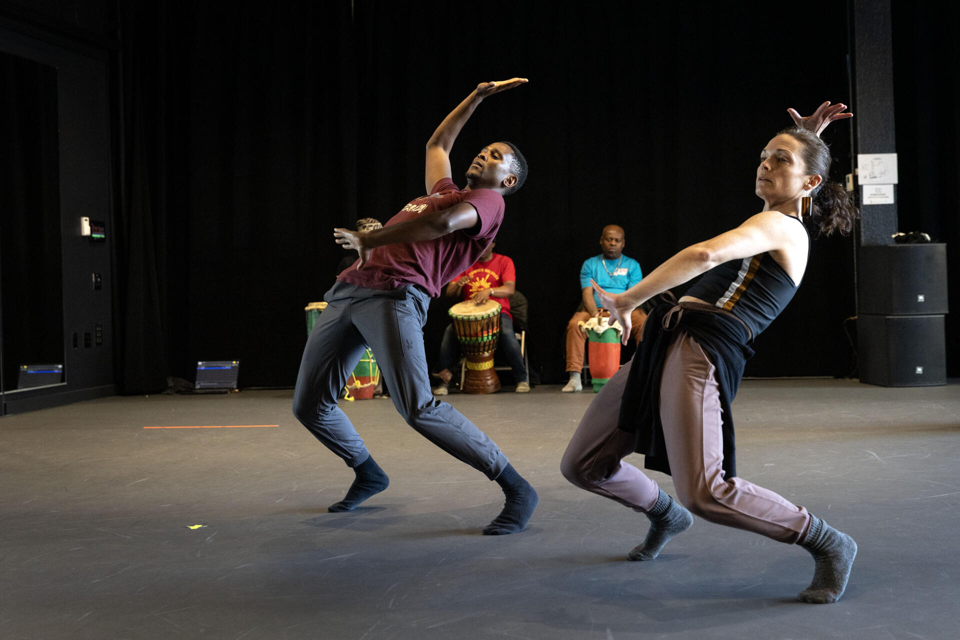 Dancers Mcebisi Xotyeni and Meg McGrath dance at a performance rehearsal at the Jean Appolon Expressions Dance Center in Nubian Square, Roxbury. (Robin Lubbock/WBUR)
